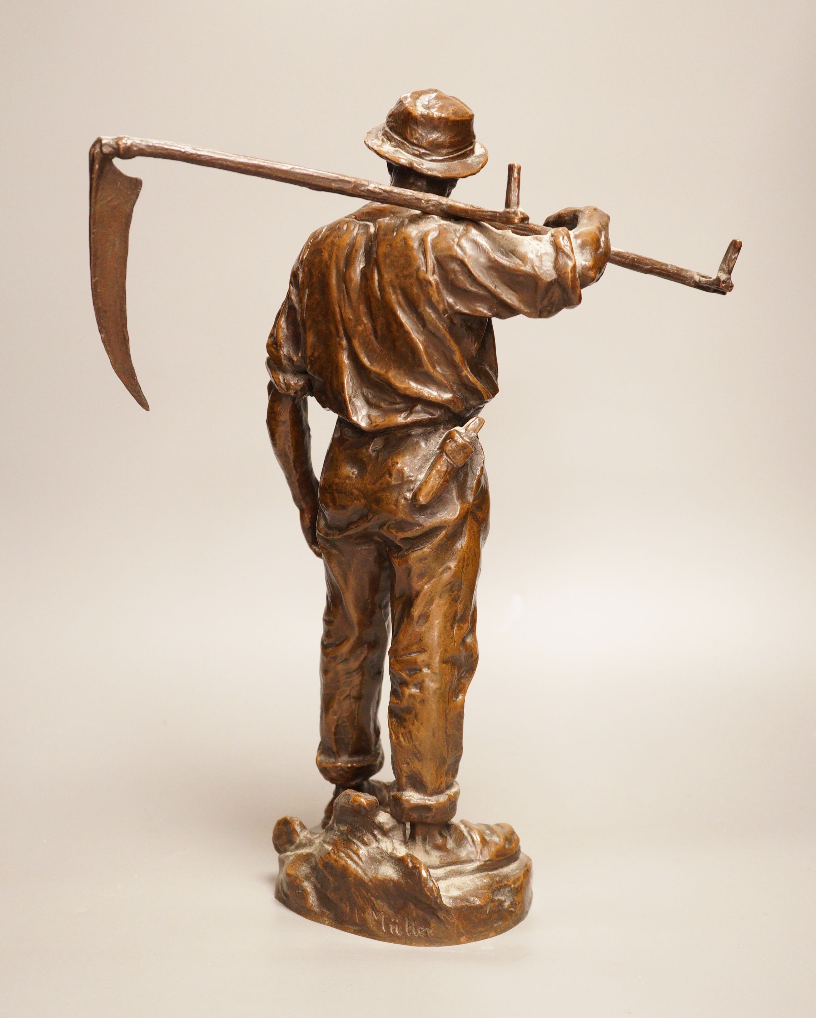 Hans Muller (Austrian, 1837-1937) a bronze group of a farmhand with scythe, signed to base, 39cm tall